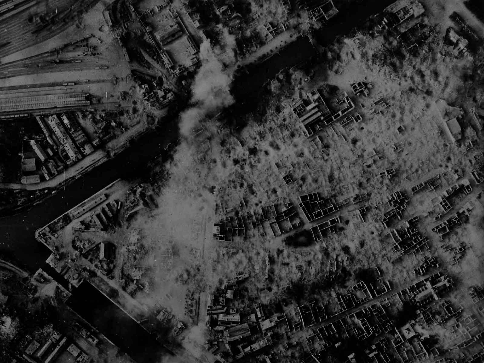 Vertical aerial photograph of Caen, c. June 1944. Railway lines visibile in top left corner. Vertical aerial photograph of Caen, c. June 1944. Railway lines visibile in top left corner.
