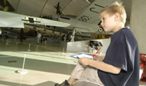 Young Boy in Milestones of Flight drawing.