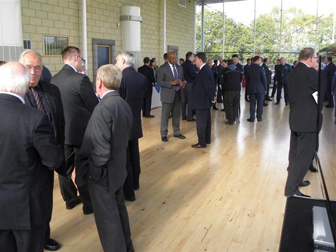 Invited guests gathering for the unveiling event.