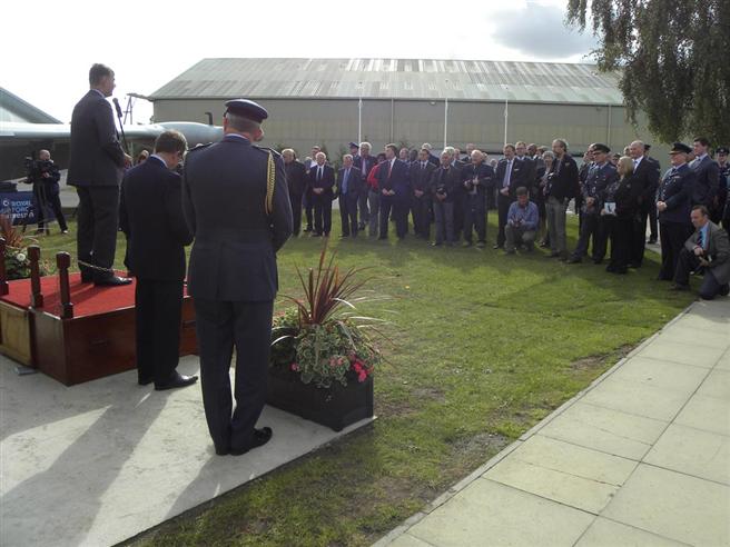 Invited guests viewing the aircraft and listening to speeches.
