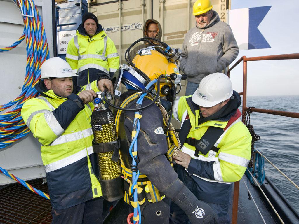 Crew kitting up and checking equipment.