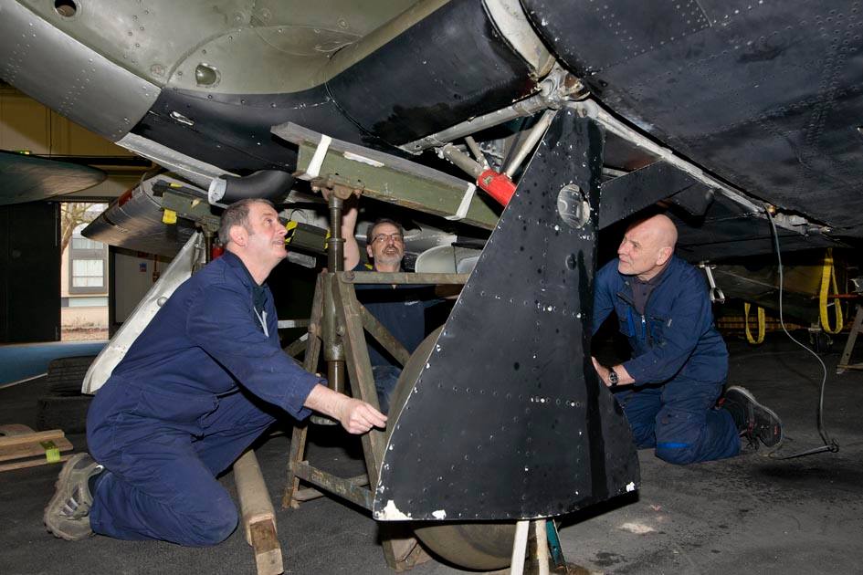 Members of the Museum's MBCC surveying Hawker Hurricane 1 Members of the Museum's MBCC surveying Hawker Hurricane 1