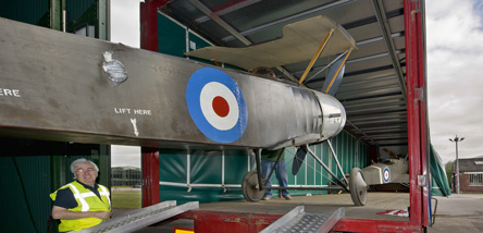Aircraft being placed into truck for transport Aircraft being placed into truck for transport