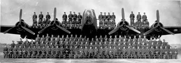 Group photograph of 158 Squadron in front and on top of a Handley Page Halifax Mk. III (P013472) Group photograph of 158 Squadron in front and on top of a Handley Page Halifax Mk. III (P013472)