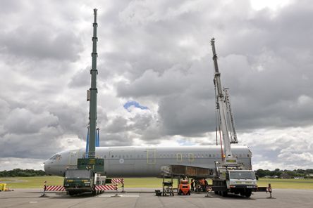 Fuselage being unloaded Two cranes unload the fuselage on the airfield