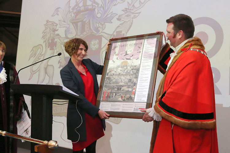 Museum CEO Maggie Appleton presenting the Worshipful Mayor of Barnet, Reuben Thompstone, with a framed copy of our Historic Hendon Poster