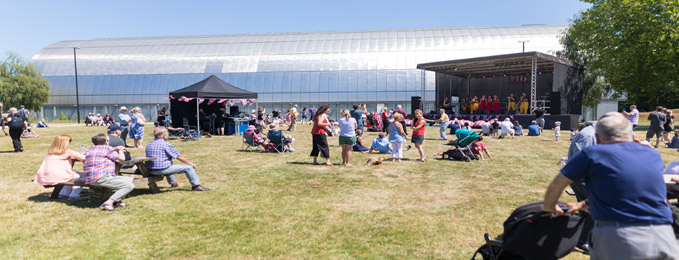 Members of the public enjoying an outdoor concert on London's new 'airfield'