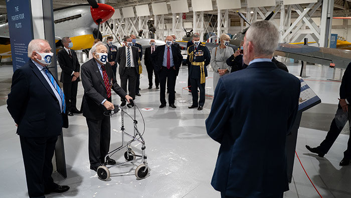 Honoured Guests being given a tour of London's Battle of Britain displays by Ian Thirsk the Museum's Head of Collections