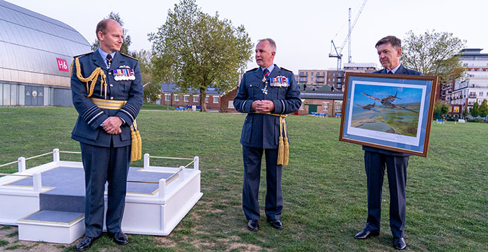 Malcolm Brecht CB CBE Officer Commanding 601 (County of London) Sqn RAuxAF (centre) and Wg Cdr John Chappell MBE 601 (County of London) Sqn RAuxAF (right) presenting CAS (left) with a painting of 601 Squadron in an engagement during the Battle of Britain