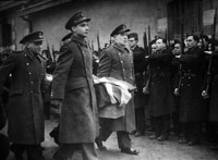 Flt Lt Ralph Laronde and Flt Lt Noel Archer and colleagues from the MRES bearing an exhumed coffin to a reburial ceremony at an official war grave somewhere in France.