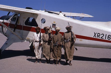Local tribesmen guarding a De Havilland DHC-2 Beaver of the Sultan of Oman's Air Force Local tribesmen guarding a De Havilland DHC-2 Beaver of the Sultan of Oman's Air Force