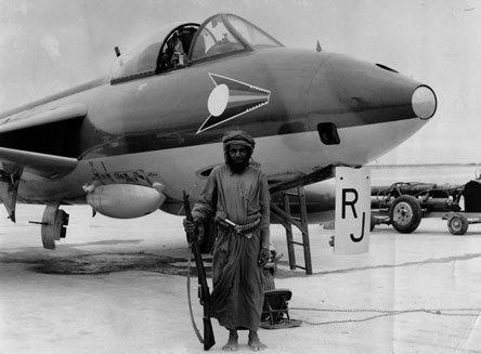 A Hawker Hunter FR10 flown by Fl Lt Richard Johns of No 1417 Flight at RAF Salalah in 1965. The aircraft is guarded by a local Omani, that the pilots nicknamed 'Elvis' A Hawker Hunter FR10 flown by Fl Lt Richard Johns of No 1417 Flight at RAF Salalah in 1965. The aircraft is guarded by a local Omani, that the pilots nicknamed 'Elvis'